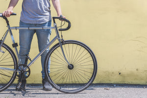 a man holding a bike